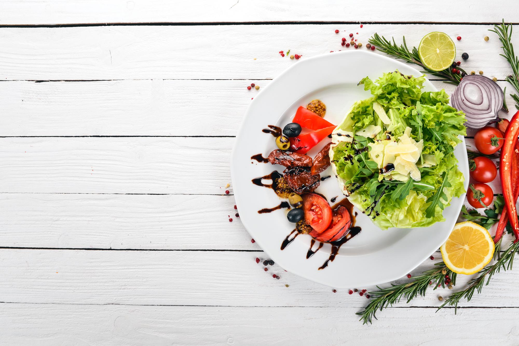 Close-up of plated quick gourmet meal on wooden table